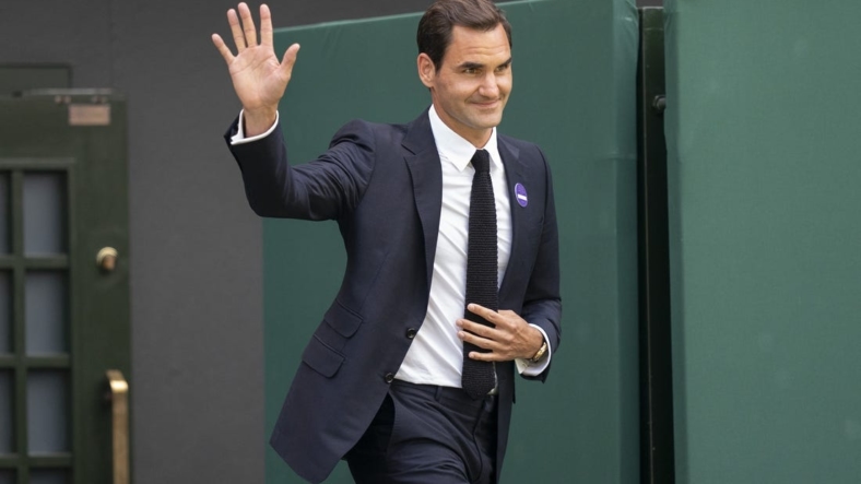Jul 3, 2022; London, United Kingdom; On the inaugural middle Sunday for play, Wimbledon celebrates 100 years since their move to Church Road and the centenary of Centre Court. Past champions were on court for this special ceremony on day seven at All England Lawn Tennis and Croquet Club. Shown here: Roger Federer (SUI). Mandatory Credit: Susan Mullane-USA TODAY Sports