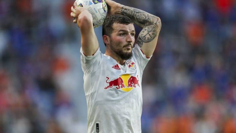 Jul 9, 2022; Cincinnati, Ohio, USA; New York Red Bulls defender Tom Edwards (7) throws in the ball against FC Cincinnati in the second half at TQL Stadium. Mandatory Credit: Katie Stratman-USA TODAY Sports