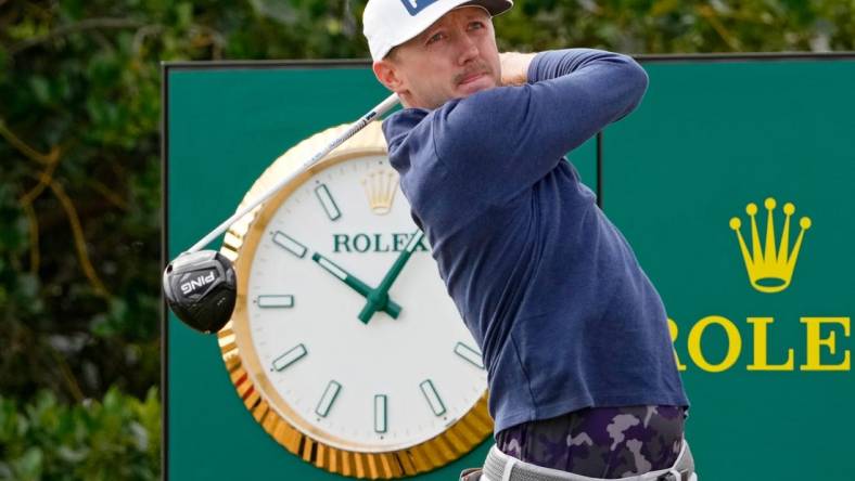 Jul 14, 2022; St. Andrews, SCT; Mackenzie Hughes tees off on the third hole during the first round of the 150th Open Championship golf tournament at St. Andrews Old Course. Mandatory Credit: Michael Madrid-USA TODAY Sports