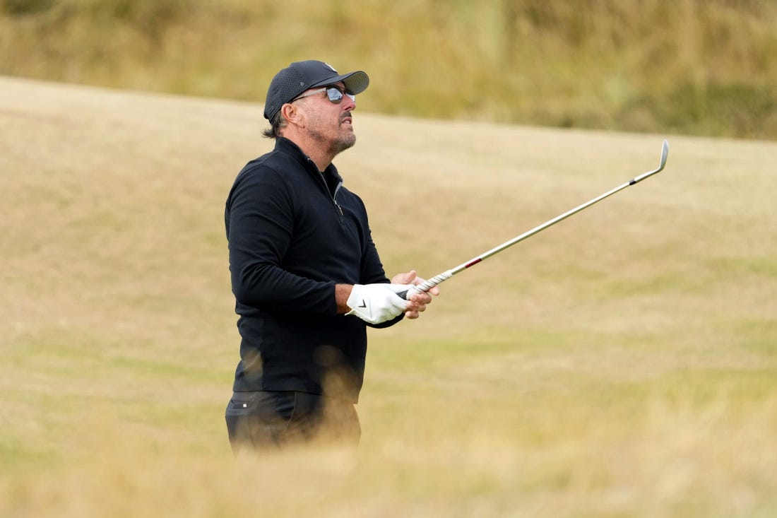 Jul 14, 2022; St. Andrews, SCT; Phil Mickelson takes a shot on the fifth fairway during the first round of the 150th Open Championship golf tournament at St. Andrews Old Course. Mandatory Credit: Rob Schumacher-USA TODAY Sports