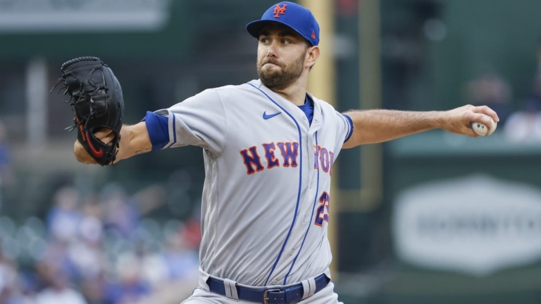 Jul 17, 2022; Chicago, Illinois, USA; New York Mets starting pitcher David Peterson (23) delivers against the Chicago Cubs during the first inning at Wrigley Field. Mandatory Credit: Kamil Krzaczynski-USA TODAY Sports