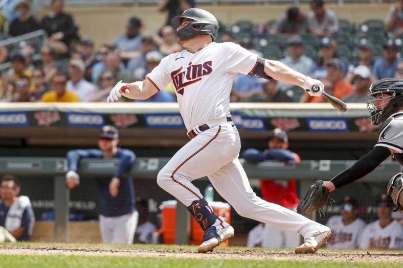 Jul 17, 2022; Minneapolis, Minnesota, USA; Minnesota Twins catcher Caleb Hamilton (90) makes his major league debut grounding out to short against the Chicago White Sox in his first at-bat in the eighth inning at Target Field. Mandatory Credit: Bruce Kluckhohn-USA TODAY Sports