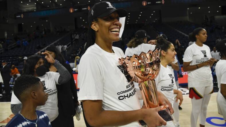 Jul 26, 2022; Chicago, IL, USA;  Las Vegas Aces forward A'ja Wilson (22) with the trophy after they won the Commissioners Cup-Championships with a victory over the Chicago Sky 93-83, at Wintrust Arena. Mandatory Credit: Matt Marton-USA TODAY Sports