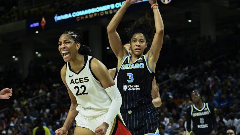 Jul 26, 2022; Chicago, IL, USA;  Las Vegas Aces forward A'ja Wilson (22) yells after scoring against Chicago Sky forward Candace Parker (3) during the second half of the Commissioners Cup-Championships at Wintrust Arena. Mandatory Credit: Matt Marton-USA TODAY Sports