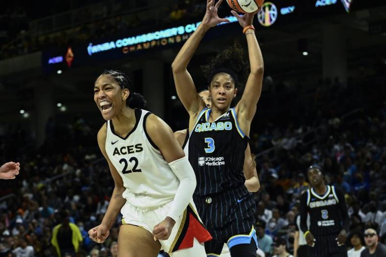 Jul 26, 2022; Chicago, IL, USA;  Las Vegas Aces forward A'ja Wilson (22) yells after scoring against Chicago Sky forward Candace Parker (3) during the second half of the Commissioners Cup-Championships at Wintrust Arena. Mandatory Credit: Matt Marton-USA TODAY Sports