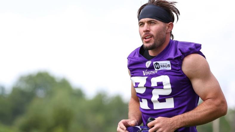 Jul 27, 2022; Eagan, MN, USA; Minnesota Vikings safety Harrison Smith (22) runs out onto the field at TCO Performance Center. Mandatory Credit: Matt Krohn-USA TODAY Sports