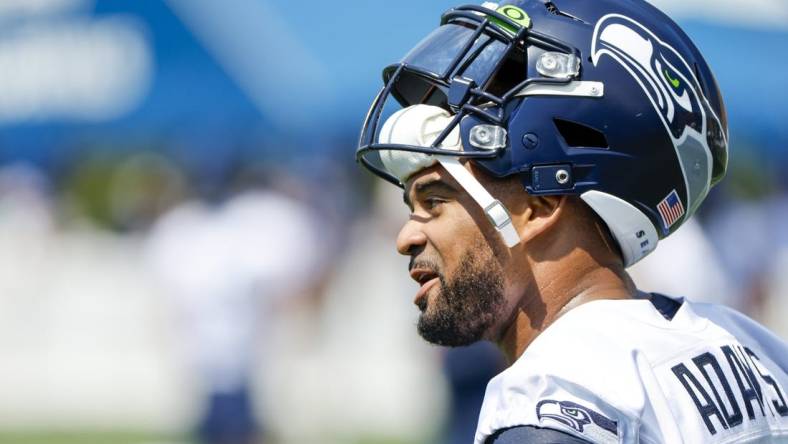 Jul 27, 2022; Renton, WA, USA; Seattle Seahawks safety Jamal Adams (33) talks with a teammate during training camp practice at Virginia Mason Athletic Center. Mandatory Credit: Joe Nicholson-USA TODAY Sports