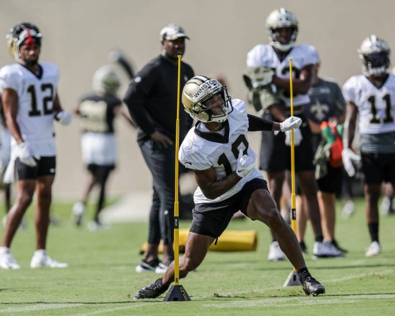 Jul 29, 2022; Metairie, LA, USA;  New Orleans Saints wide receiver Michael Thomas (13) works on receiver drills  during training camp at Ochsner Sports Performance Center. Mandatory Credit: Stephen Lew-USA TODAY Sports