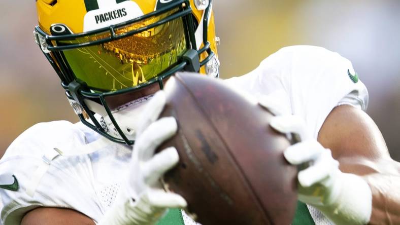 Aug 5, 2022; Green Bay, WI, USA; Lambeau Field is reflected off the visor of Green Bay Packers wide receiver Allen Lazard as he catches a pass at Lambeau Field. Mandatory Credit: Samantha Madar/Green Bay Press Gazette -USA TODAY NETWORK