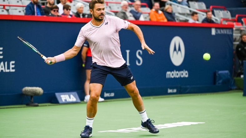 Aug 8, 2022; Montreal, Quebec, Canada; Stan Wawrinka (SUI) hits a shot against Emil Ruusuvuori (FIN) (not pictured) during first round play at IGA Stadium. Mandatory Credit: David Kirouac-USA TODAY Sports