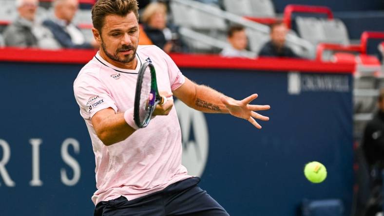 Aug 8, 2022; Montreal, Quebec, Canada; Stan Wawrinka (SUI) hits a shot against Emil Ruusuvuori (FIN) (not pictured) during first round play at IGA Stadium. Mandatory Credit: David Kirouac-USA TODAY Sports