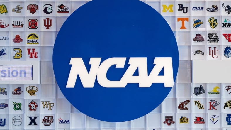 University logos cover a wall in the lobby of NCAA headquarters Thursday, Feb. 25, 2021, in Indianapolis.Ncaa National Collegiate Athletics Association Office Headquarters In Indianapolis Feb 25 2021