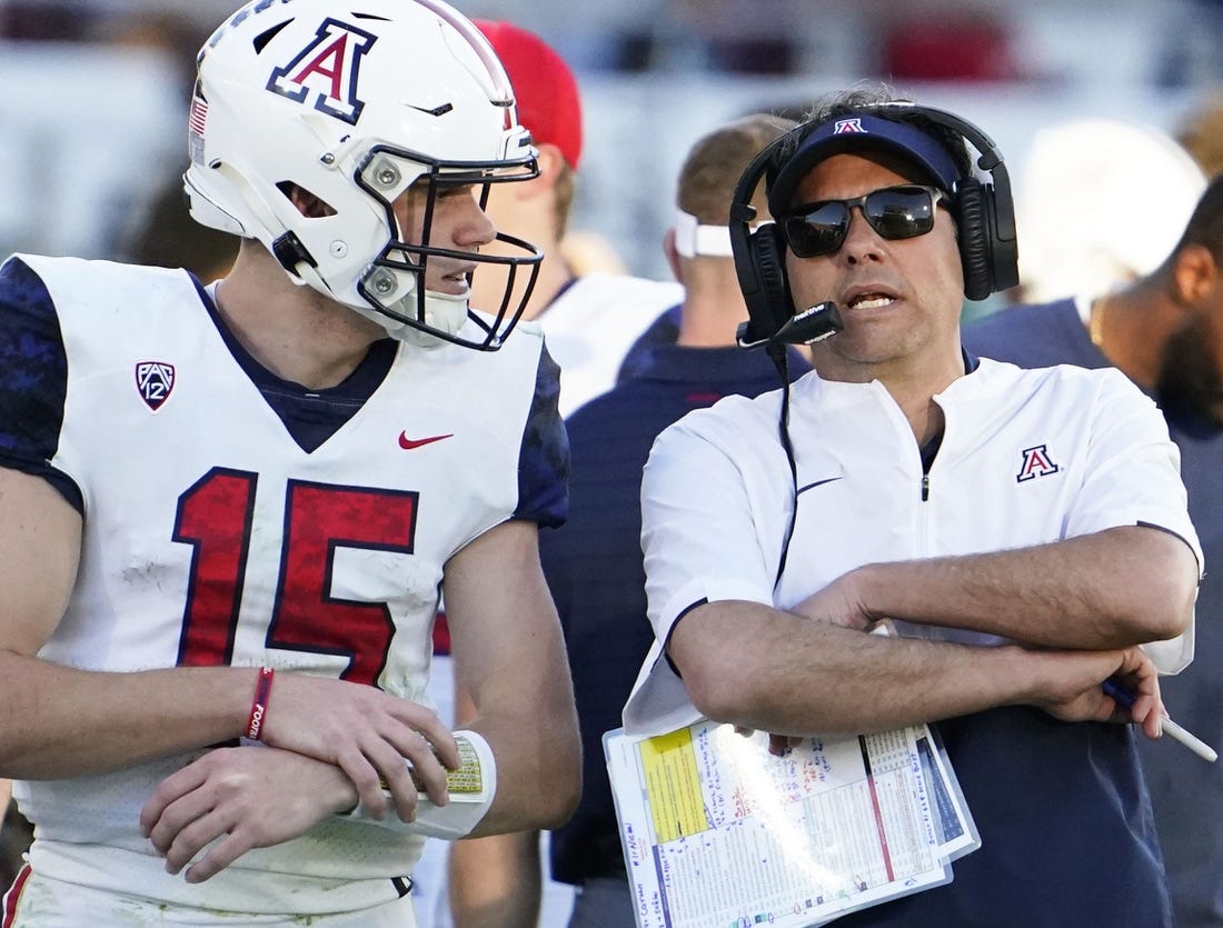 Nov 27, 2021; Tempe, Arizona, USA; Arizona Wildcats quarterback Will Plummer (15) talks to head coach Jedd Fisch during action against the Arizona State Sun Devils during the 95th Territorial Cup game at Sun Devil Stadium.

Syndication Arizona Republic