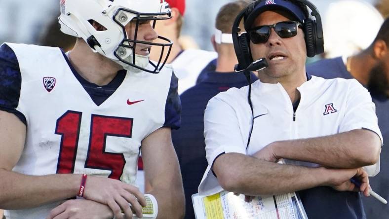 Nov 27, 2021; Tempe, Arizona, USA; Arizona Wildcats quarterback Will Plummer (15) talks to head coach Jedd Fisch during action against the Arizona State Sun Devils during the 95th Territorial Cup game at Sun Devil Stadium.

Syndication Arizona Republic