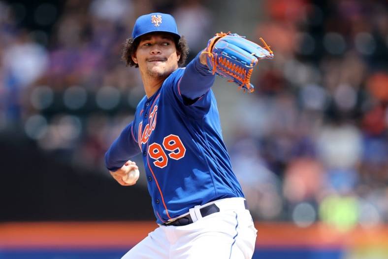 Aug 10, 2022; New York City, New York, USA; New York Mets starting pitcher Taijuan Walker (99) pitches against the Cincinnati Reds during the first inning at Citi Field. Mandatory Credit: Brad Penner-USA TODAY Sports