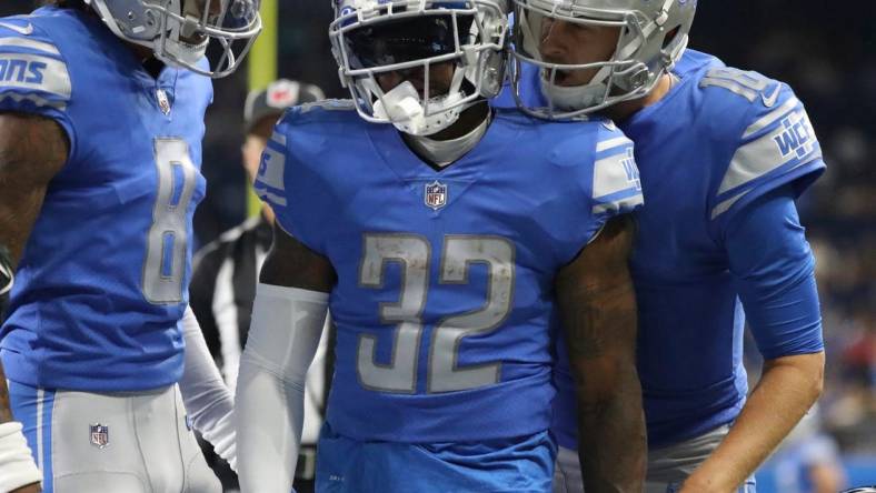 Aug 12, Detroit, MI, USA;  Detroit Lions quarterback Jared Goff (right) celebrates with running back D'Andre Swift (32) after his touchdown against the Atlanta Falcons during the first half of a preseason game Aug.12, 2022 at Ford Field. Mandatory Credit: Kirthmon F. Dozier-USA TODAY Sports