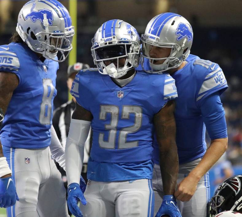 Aug 12, Detroit, MI, USA;  Detroit Lions quarterback Jared Goff (right) celebrates with running back D'Andre Swift (32) after his touchdown against the Atlanta Falcons during the first half of a preseason game Aug.12, 2022 at Ford Field. Mandatory Credit: Kirthmon F. Dozier-USA TODAY Sports