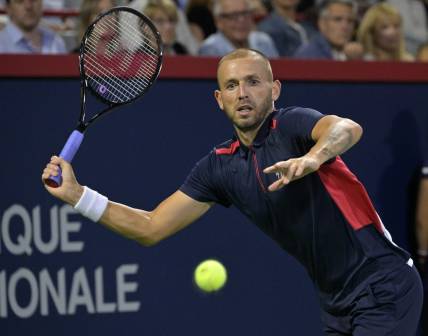 Aug 13, 2022; Montreal, QC, Canada; Daniel Evans (GBR) hits a forehand against Pablo Carreno Busta (ESP) (not pictured) in semifinal play in the National Bank Open at IGA Stadium. Mandatory Credit: Eric Bolte-USA TODAY Sports