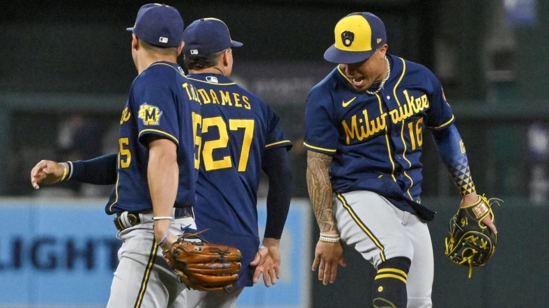 Aug 13, 2022; St. Louis, Missouri, USA;  Milwaukee Brewers second baseman Kolten Wong (16) celebrates with shortstop Willy Adames (27) after the Brewers defeated the St. Louis Cardinals in ten innings at Busch Stadium. Mandatory Credit: Jeff Curry-USA TODAY Sports