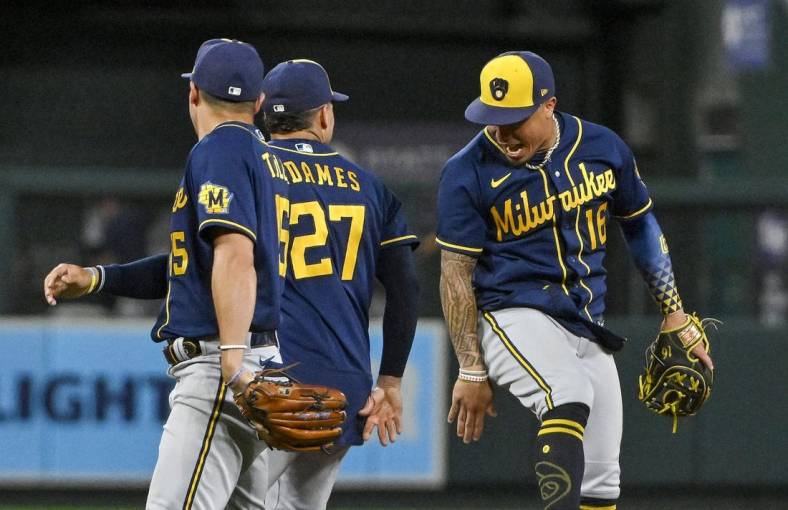 Aug 13, 2022; St. Louis, Missouri, USA;  Milwaukee Brewers second baseman Kolten Wong (16) celebrates with shortstop Willy Adames (27) after the Brewers defeated the St. Louis Cardinals in ten innings at Busch Stadium. Mandatory Credit: Jeff Curry-USA TODAY Sports