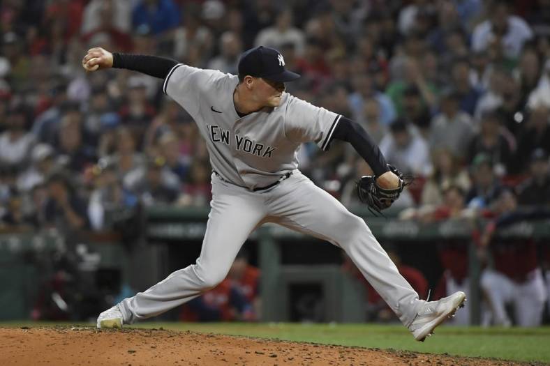 Aug 13, 2022; Boston, Massachusetts, USA;  New York Yankees relief pitcher Scott Effross (59) pitches during the ninth inning against the Boston Red Sox at Fenway Park. Mandatory Credit: Bob DeChiara-USA TODAY Sports