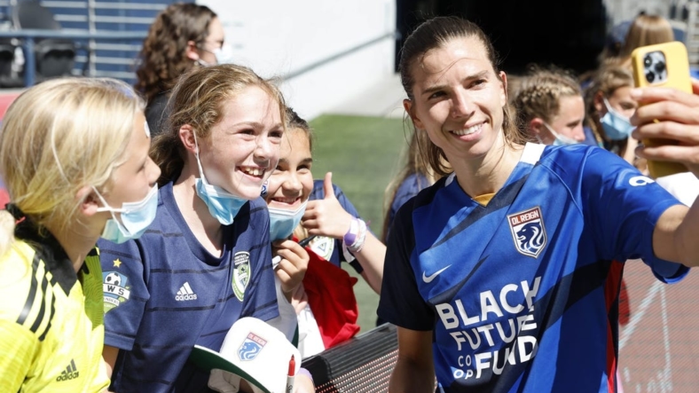 Aug 14, 2022; Seattle, Washington, USA; OL Reign forward Tobin Heath (77) reacts with fans after the game against the NJ/NY Gotham FC at Lumen Field. Mandatory Credit: Joe Nicholson-USA TODAY Sports