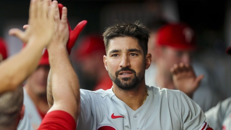 Aug 16, 2022; Cincinnati, Ohio, USA; Philadelphia Phillies right fielder Nick Castellanos (8) high fives teammates after hitting a solo home run in the third inning against the Cincinnati Reds at Great American Ball Park. Mandatory Credit: Katie Stratman-USA TODAY Sports