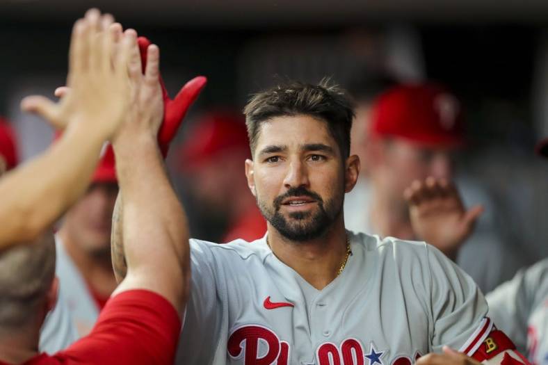 Aug 16, 2022; Cincinnati, Ohio, USA; Philadelphia Phillies right fielder Nick Castellanos (8) high fives teammates after hitting a solo home run in the third inning against the Cincinnati Reds at Great American Ball Park. Mandatory Credit: Katie Stratman-USA TODAY Sports