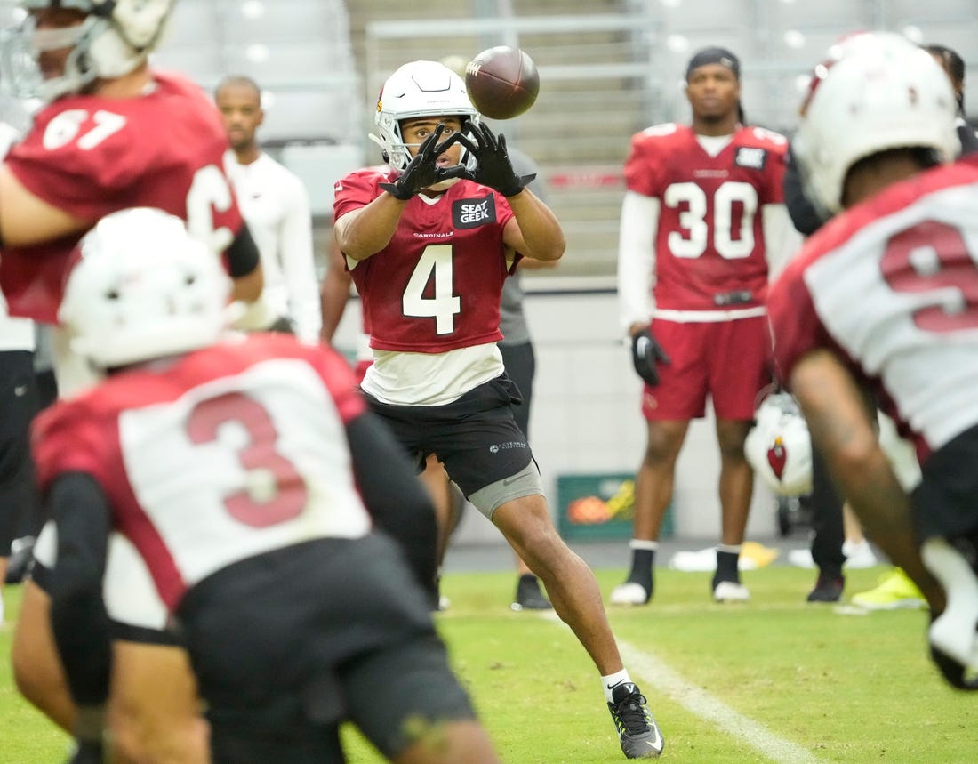 Aug 8, 2022; Glendale, Arizona, U.S.;  Arizona Cardinals wide receiver Rondale Moore (4) catches a pass during training camp at State Farm Stadium.

Nfl Cardinals Practice