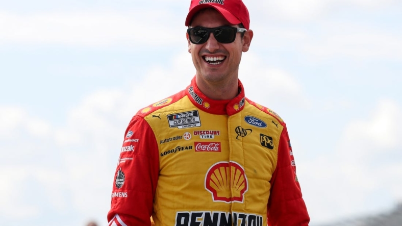Aug 20, 2022; Watkins Glen, New York, USA; NASCAR Cup Series driver Joey Logano walks on pit road during practice and qualifying for the Go Bowling at The Glen at Watkins Glen International. Mandatory Credit: Matthew OHaren-USA TODAY Sports