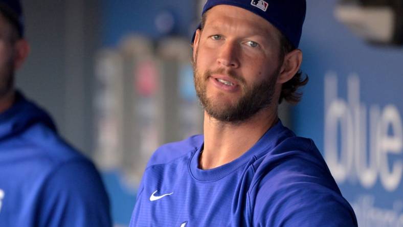 Aug 20, 2022; Los Angeles, California, USA;  Los Angeles Dodgers starting pitcher Clayton Kershaw (22) looks on from the dugout prior to a game against the Miami Marlins at Dodger Stadium. Mandatory Credit: Jayne Kamin-Oncea-USA TODAY Sports