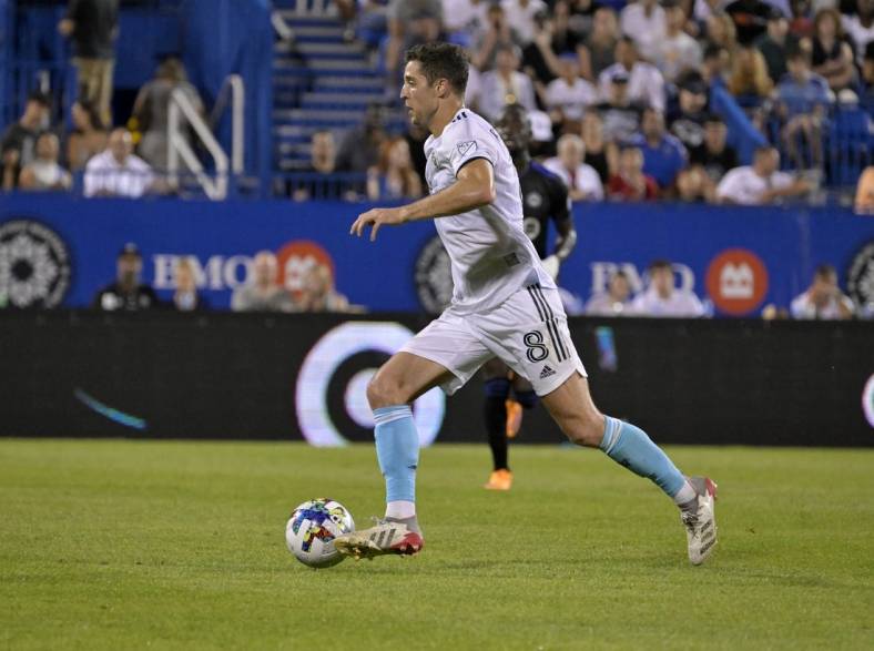 Aug 20, 2022; Montreal, Quebec, CAN; New England Revolution midfielder Matt Polster (8) controls the ball against CF Montreal during the second half at Stade Saputo. Mandatory Credit: Eric Bolte-USA TODAY Sports