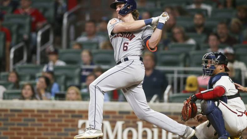 Aug 20, 2022; Atlanta, Georgia, USA; Houston Astros center fielder Jake Meyers (6) hits a RBI single against the Atlanta Braves in the tenth inning at Truist Park. Mandatory Credit: Brett Davis-USA TODAY Sports