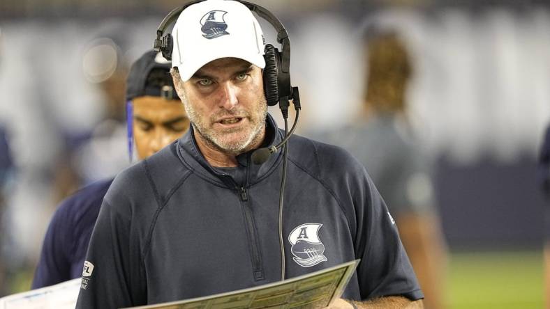 Aug 20, 2022; Toronto, Ontario, CAN; Toronto Argonauts head coach Ryan Dinwiddie talks on his headset during the second half against the Calgary Stampeders at BMO Field. Mandatory Credit: John E. Sokolowski-USA TODAY Sports