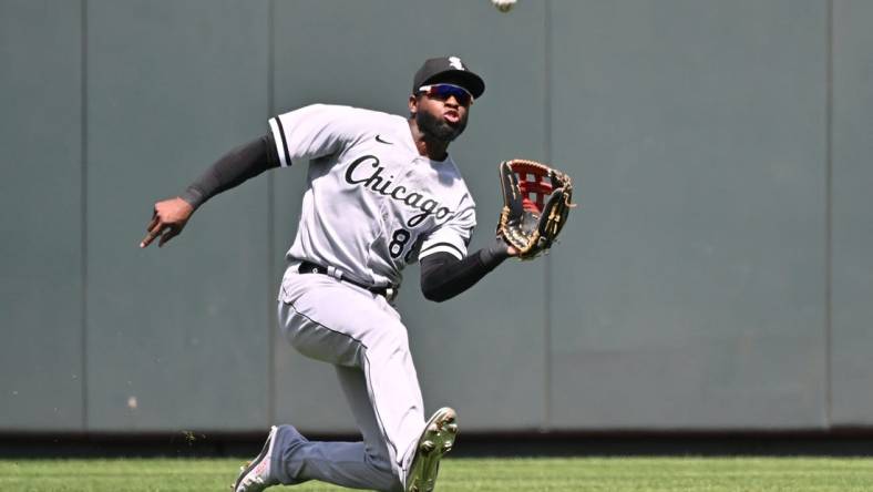 Aug 22, 2022; Kansas City, Missouri, USA;  Chicago White Sox center fielder Luis Robert (88) makes a sliding catch during the third inning against the Kansas City Royals at Kauffman Stadium. Mandatory Credit: Peter Aiken-USA TODAY Sports