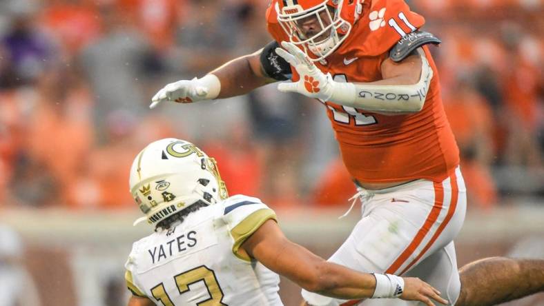 Clemson defensive lineman Bryan Bresee (11) pressures Georgia Tech freshman Jordan Yates (13) during the third quarter in Clemson, S.C., September 18, 2021.

Ncaa Football Georgia Tech At Clemson