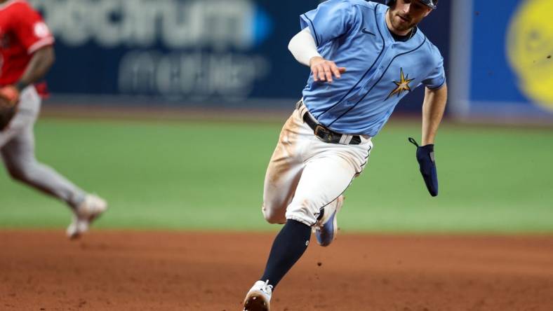 Aug 24, 2022; St. Petersburg, Florida, USA;  Tampa Bay Rays second baseman Brandon Lowe (8) rounds third base against the Los Angeles Angels in the eleventh inning at Tropicana Field. Mandatory Credit: Nathan Ray Seebeck-USA TODAY Sports