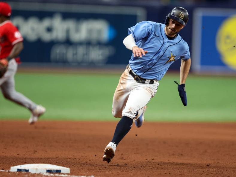 Aug 24, 2022; St. Petersburg, Florida, USA;  Tampa Bay Rays second baseman Brandon Lowe (8) rounds third base against the Los Angeles Angels in the eleventh inning at Tropicana Field. Mandatory Credit: Nathan Ray Seebeck-USA TODAY Sports
