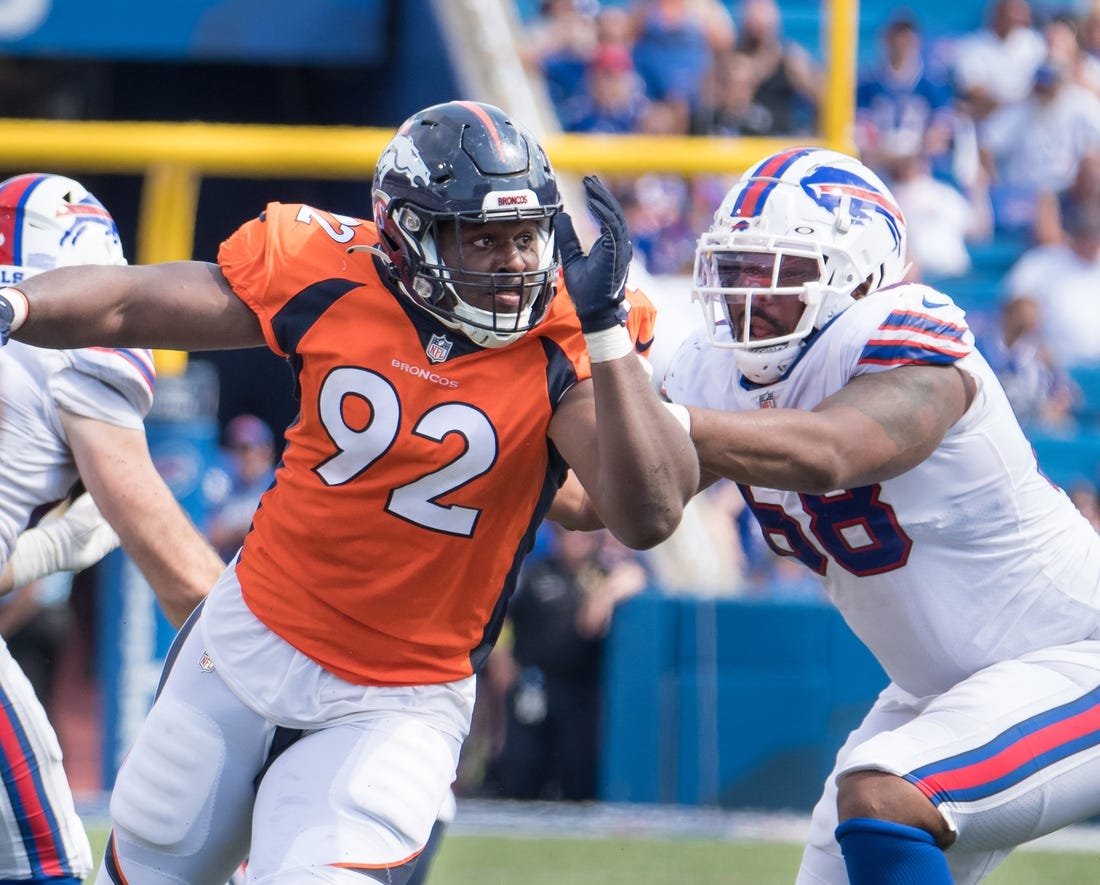 Aug 20, 2022; Orchard Park, New York, USA; Denver Broncos defensive tackle Jonathan Harris (92) with Buffalo Bills tackle Bobby Hart (68) in the third quarter of a pre-season game at Highmark Stadium. Mandatory Credit: Mark Konezny-USA TODAY Sports