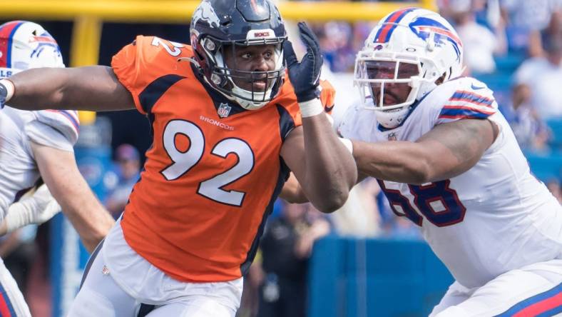 Aug 20, 2022; Orchard Park, New York, USA; Denver Broncos defensive tackle Jonathan Harris (92) with Buffalo Bills tackle Bobby Hart (68) in the third quarter of a pre-season game at Highmark Stadium. Mandatory Credit: Mark Konezny-USA TODAY Sports