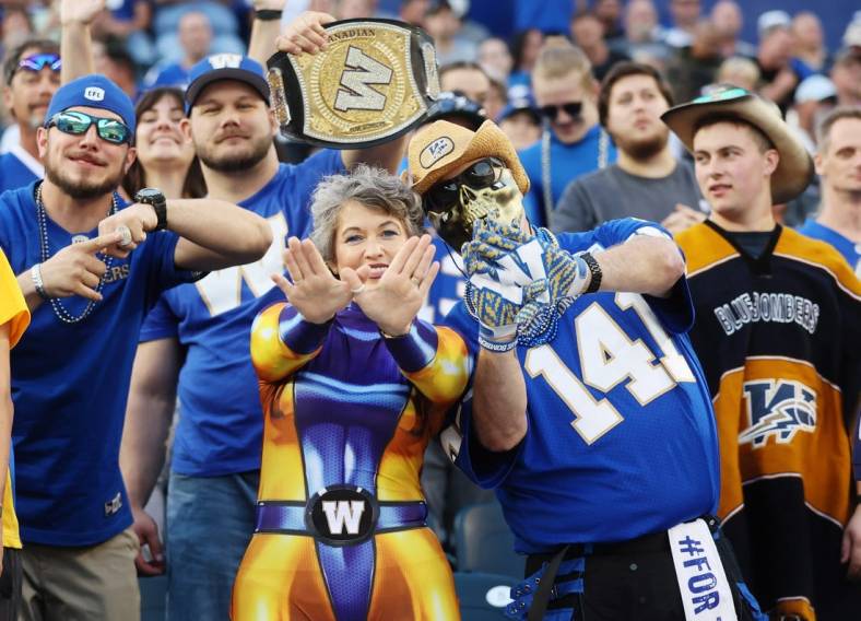 Aug 25, 2022; Winnipeg, Manitoba, CAN;  Winnipeg Blue Bombers fans react during the first half against the Calgary Stampeders at IG Field. Mandatory Credit: Bruce Fedyck-USA TODAY Sports