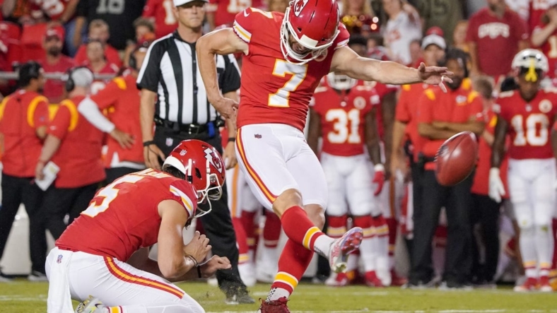 Aug 25, 2022; Kansas City, Missouri, USA; Kansas City Chiefs place kicker Harrison Butker (7) kicks a point after touchdown against the Green Bay Packers during the second half at GEHA Field at Arrowhead Stadium. Mandatory Credit: Denny Medley-USA TODAY Sports