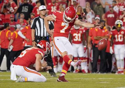 Aug 25, 2022; Kansas City, Missouri, USA; Kansas City Chiefs place kicker Harrison Butker (7) kicks a point after touchdown against the Green Bay Packers during the second half at GEHA Field at Arrowhead Stadium. Mandatory Credit: Denny Medley-USA TODAY Sports