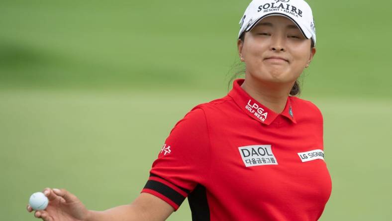 Aug 26, 2022; Ottawa, Ontario, CAN; Jin Young Ko salutes the crowd after completing her 18th hole during the second round of the CP Women's Open golf tournament. Mandatory Credit: Marc DesRosiers-USA TODAY Sports