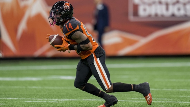Aug 26, 2022; Vancouver, British Columbia, CAN; BC Lions defensive back Marcus Sayles (14) returns a punt against the Saskatchewan Roughriders in the second half at BC Place. Mandatory Credit: Bob Frid-USA TODAY Sports