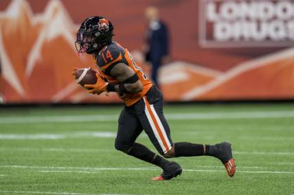 Aug 26, 2022; Vancouver, British Columbia, CAN; BC Lions defensive back Marcus Sayles (14) returns a punt against the Saskatchewan Roughriders in the second half at BC Place. Mandatory Credit: Bob Frid-USA TODAY Sports