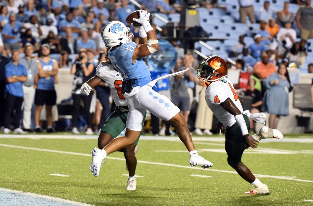 Aug 27, 2022; Chapel Hill, North Carolina, USA;North Carolina Tar Heels receiver Josh Downs (11) catches a touchdown pass during the second half against the Florida A&M Rattlers at Kenan Memorial Stadium. Mandatory Credit: Rob Kinnan-USA TODAY Sports