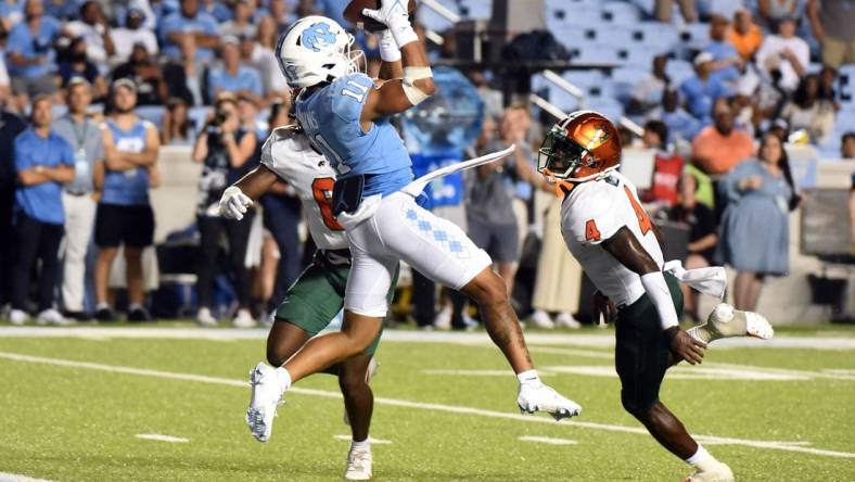 Aug 27, 2022; Chapel Hill, North Carolina, USA;North Carolina Tar Heels receiver Josh Downs (11) catches a touchdown pass during the second half against the Florida A&M Rattlers at Kenan Memorial Stadium. Mandatory Credit: Rob Kinnan-USA TODAY Sports