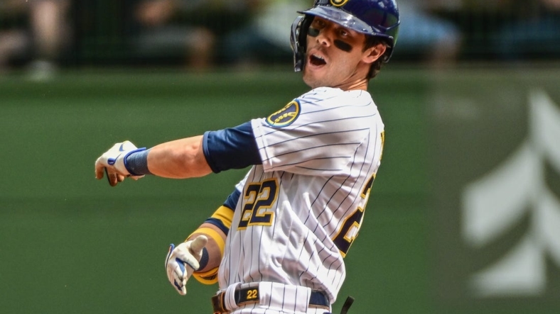 Aug 28, 2022; Milwaukee, Wisconsin, USA; Milwaukee Brewers left fielder Christian Yelich (22) reacts after he was thrown out trying to stretch a single into a double in the first inning against the Chicago Cubs at American Family Field. Mandatory Credit: Benny Sieu-USA TODAY Sports
