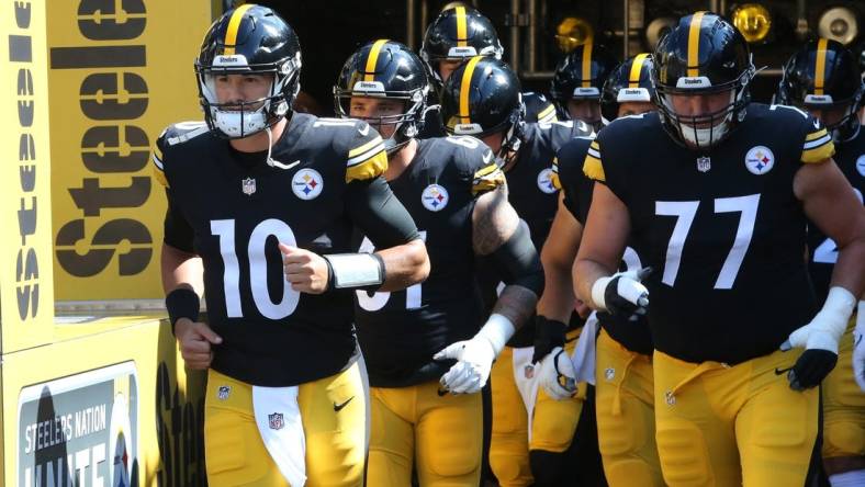 Aug 28, 2022; Pittsburgh, Pennsylvania, USA;  Pittsburgh Steelers quarterback Mitch Trubisky (10) leads the team out onto the field to warm up against the Detroit Lions at Acrisure Stadium. Mandatory Credit: Charles LeClaire-USA TODAY Sports